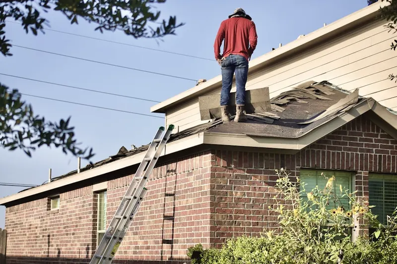 Professional roofer working on a residential roof in Bainbridge Island